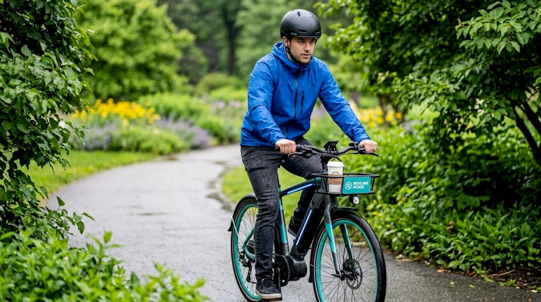 Commuter on ebike in wet city streets